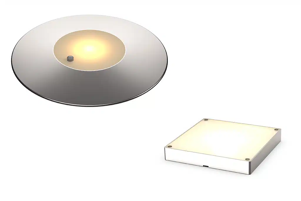 Eine Lumicoin EX-LED-Leuchte in runder Ausführung mit Taster und eine Lumicoin-EX-LED in viereckiger Ausführung.